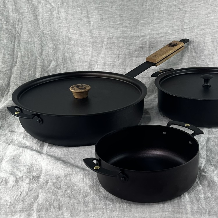 Sauteuses: Large capacity pans spun from black iron