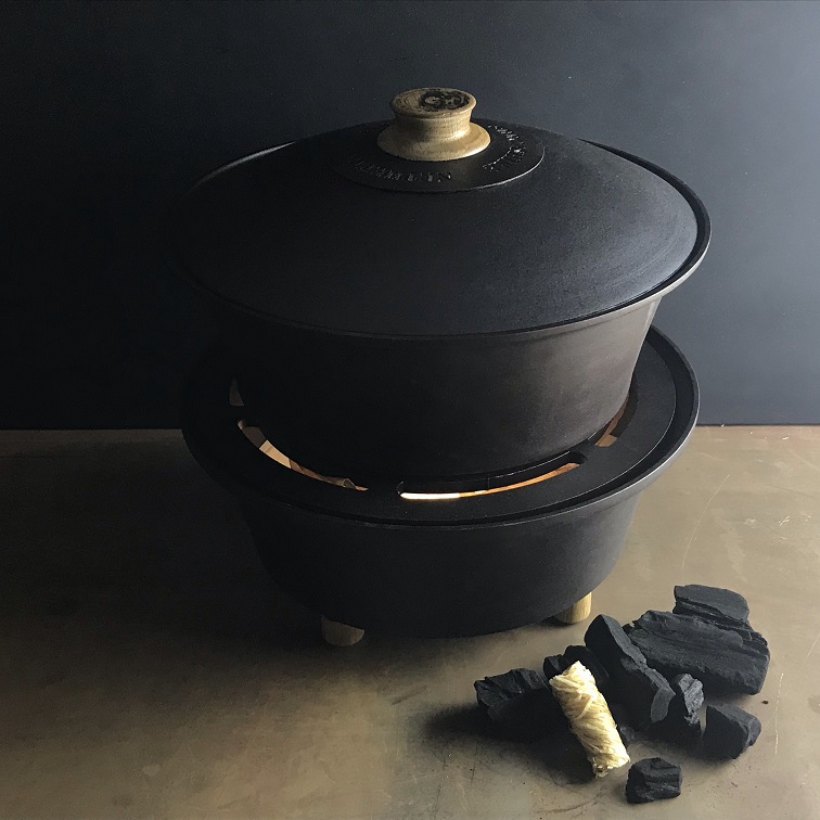 Spun black iron slow cooker.